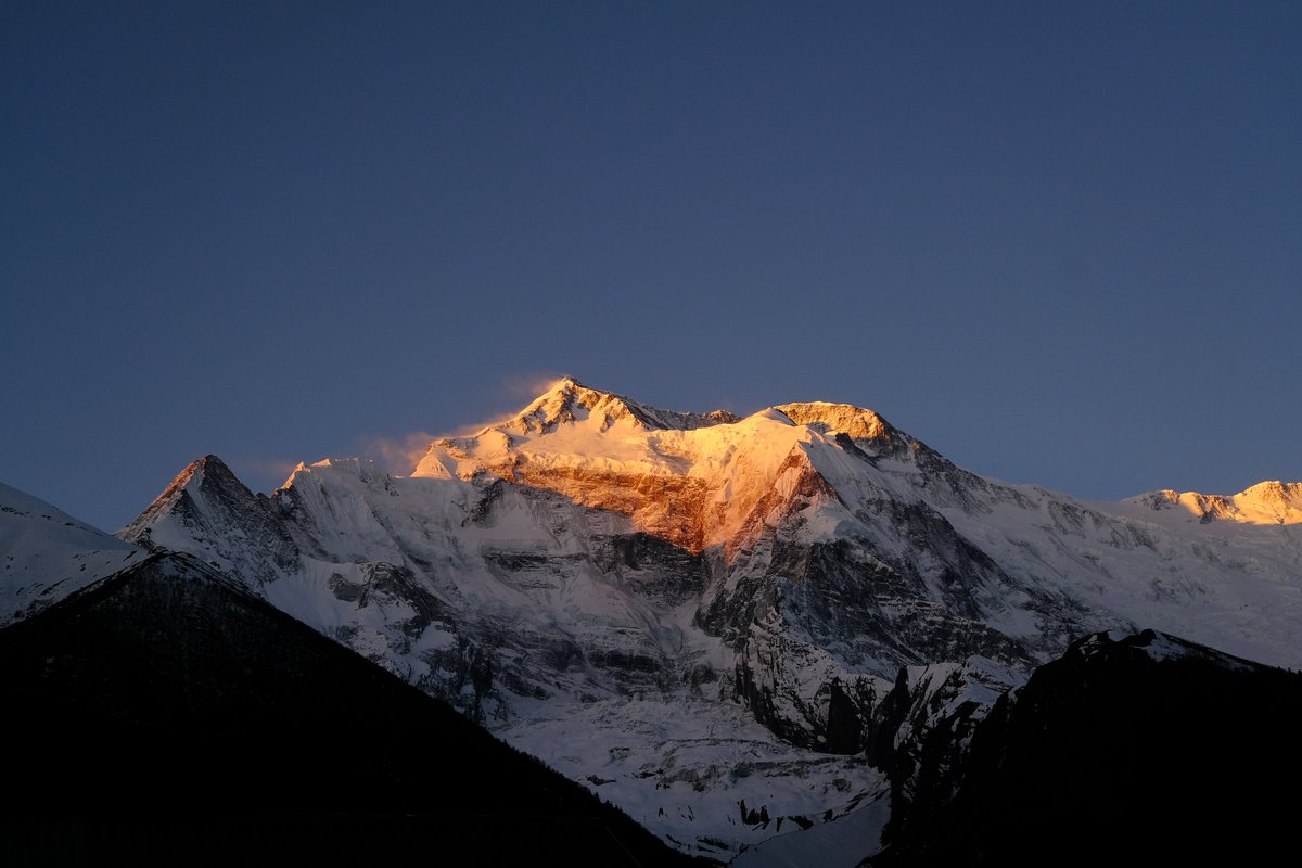 at 5.40 am, the sunrise lit up the peaks in golden colors