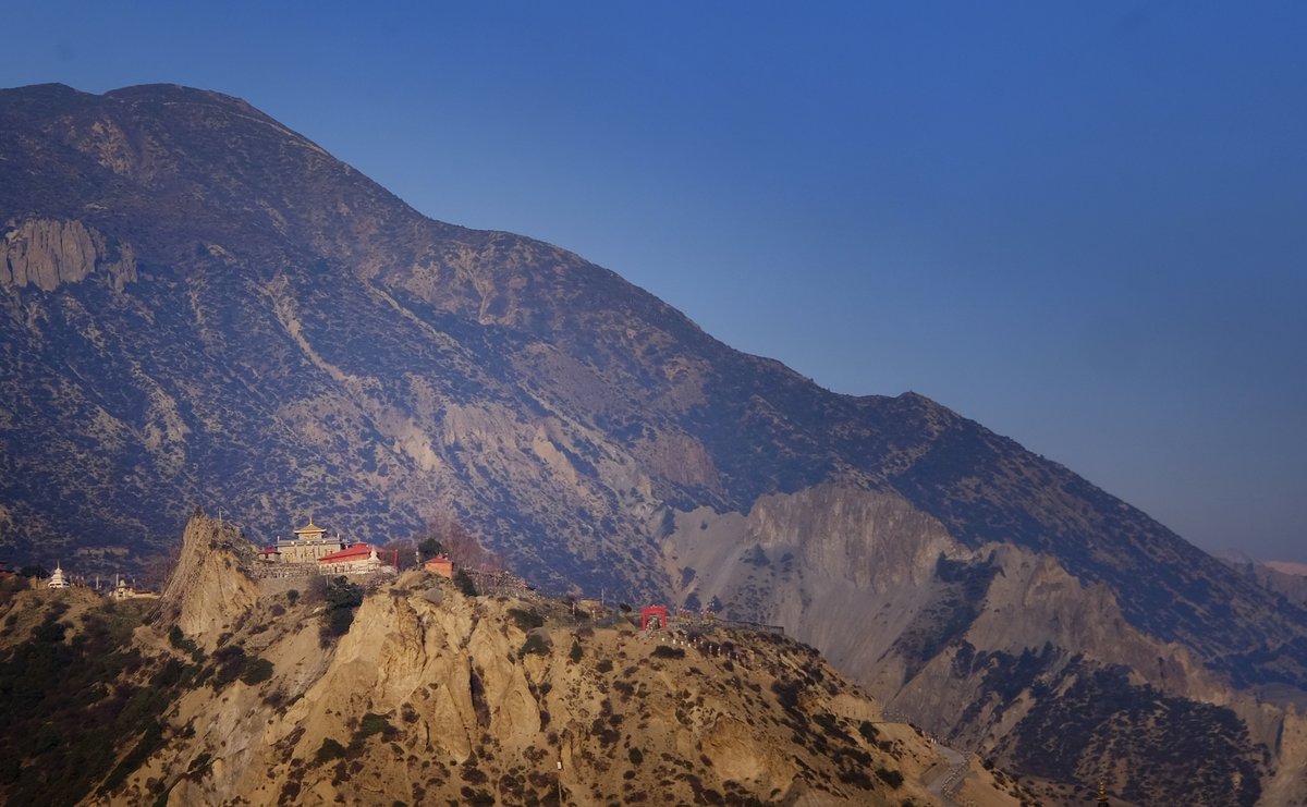 A distant monastery seen from Manang at sunset