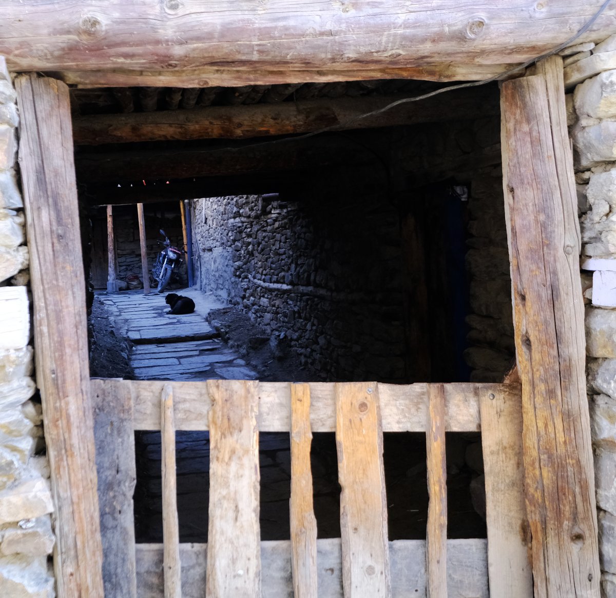 A tunnel-like entrance to a house in the village
